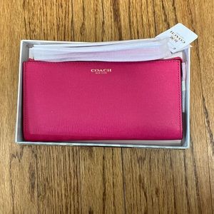 Pink Ruby Coach zippy wallet wristlet. Brand new in original packaging.